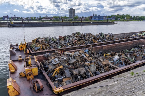 Push barge, loaded with scrap metal, for recycling, melting down, in the harbour canal,