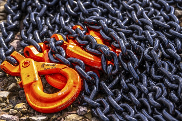 Heavy, thick chains made of steel, black chain links, orange painted hooks, Germany, Europe
