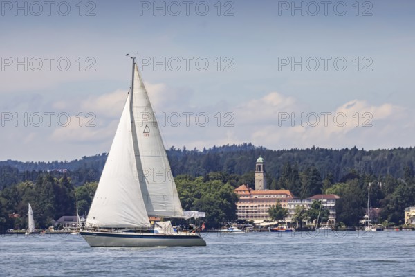 Sailing boat on Lake Constance in front of the luxury hotel Bad Schachen, Lindau, Lake Constance,