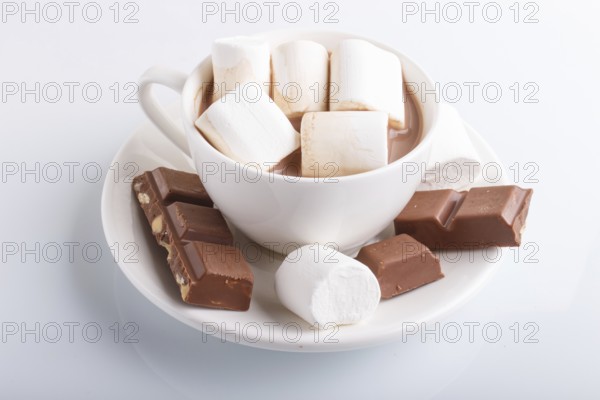 A cup of hot cocoa with marshmallow and milk chocolate isolated on white.isolated on white, closeup