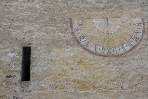 Sundial on a weathered house facade, Kaltern, South Tyrol, Italy, Europe