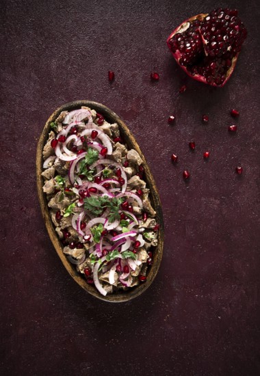 Kuchmachi, Traditional Georgian cuisine, chicken giblets appetizer, with spices and pomegranate