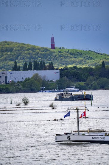 Cargo ships on the Rhine near Duisburg, in the background the Rheinpreußen spoil tip in Mörs, with