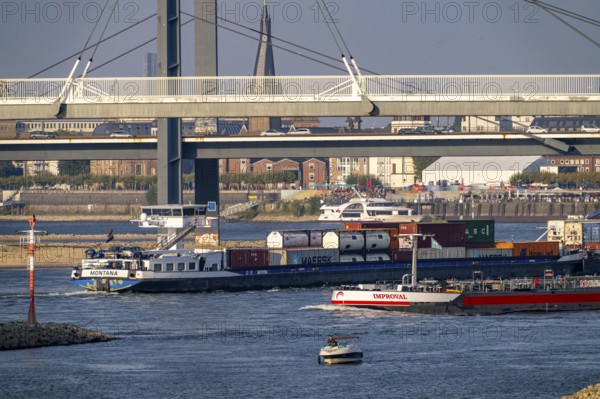 Cargo ships on the Rhine near Düsseldorf, bridge over the Media Harbour, Oberkassler Rhine Bridge,