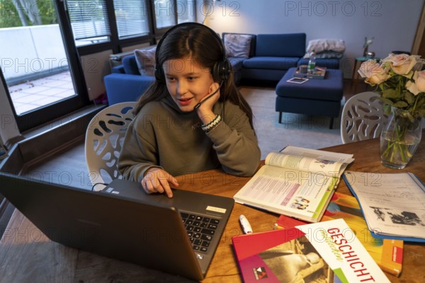 Homeschooling, girl, 11 years old, learns at home, home learning, lessons at home, distance
