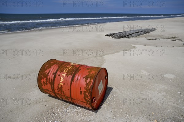 Washed up oil drum on the beach, Loango National Park, Parc National de Loango, Ogooué-Maritime