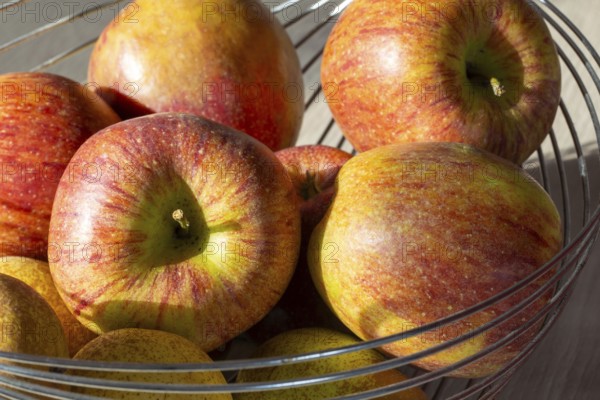 Close-up of apples and pears in the fruit basket