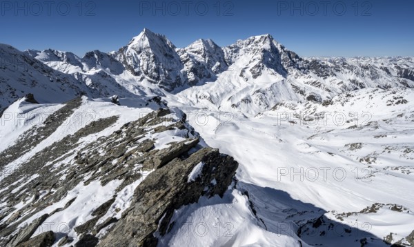 Mountain panorama with snow-covered mountain landscape in winter, view of mountain peaks