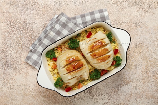 Stuffed squid carcasses, baked in the oven, fried, with couscous, top view, homemade, no people
