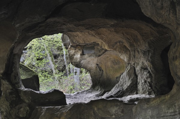 The Hohllay cave showing grooves and circles in the sandstone rock from carving millstones,