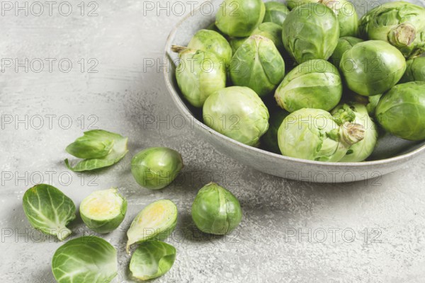 Fresh Brussels sprouts, raw, top view, on a gray table, no people