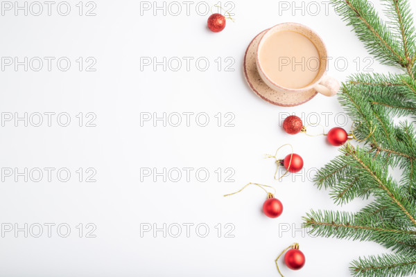 Christmas or New Year composition. Decorations, red balls, fir and spruce branches, cup of coffee,