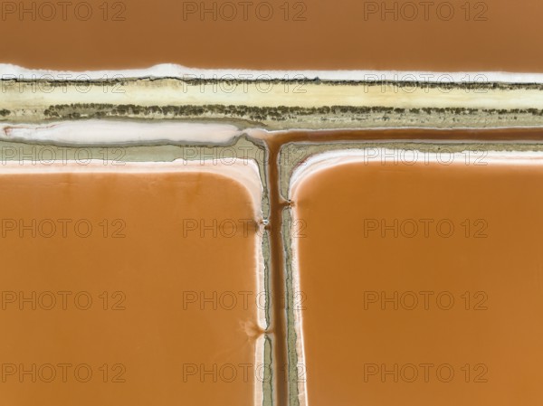 Saline ponds at the Bonanza salt works near Sanlúcar de Barrameda. The orange-red colour depends on