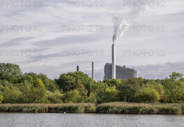 CopenHill or Amager Bakke waste incineration plant with ski slope and T-bar lift on the roof,