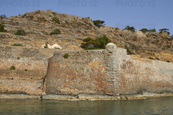 Historic stone wall on the coast with rocky landscape and sea view, Venetian sea fortress, Leper