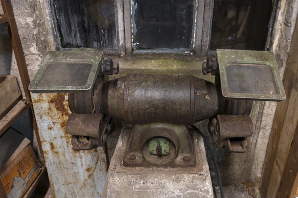 Old grinding machine in a former LPG workshop in the GDR, Mecklenburg-Vorpommern, Germany, Europe