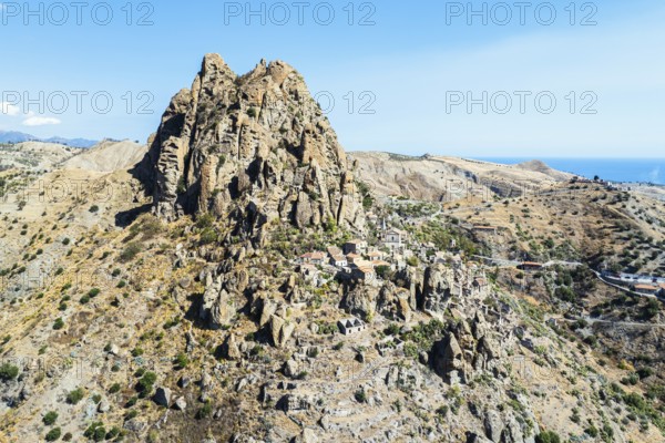 Mountains and Olive groves around Ghost Town from a drone, Pentedattilo Village, Calabria, Italy,