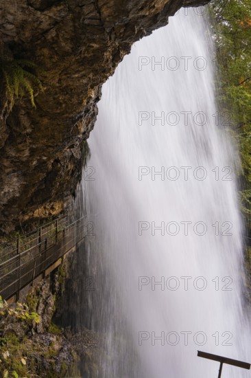 Close-up of a waterfall flowing down next to steep rocks, Lake Brienz, Switzerland, Europe