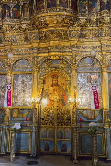 Interior of an Orthodox church with gold-decorated icons and religious artworks, Panaghia Church,