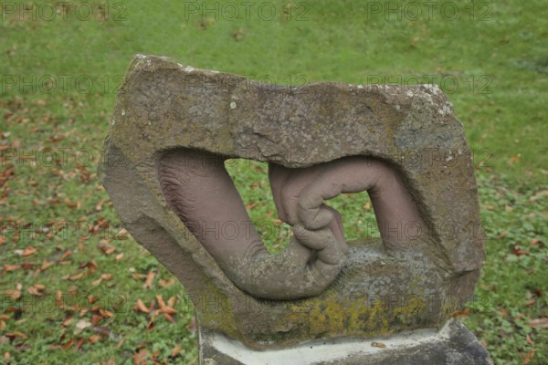 Two hands by Joachim Mennicken 2002, modern art, sandstone, looped, folded, bent, inside, into each