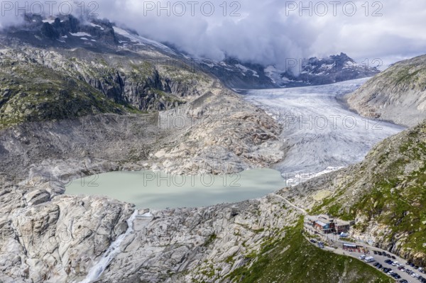 Drone shot of melting Rhone glacier, glacial lake, origin of Rhone river, Switzerland, Europe