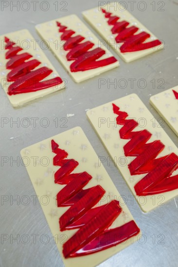 Red Christmas tree pattern on white chocolate bars, Christmas baking, Black Forest, Germany, Europe