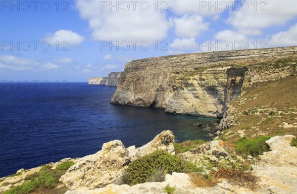 Coastal clifftop landscape view westwards at Ta' Cenc cliffs, island of Gozo, Malta, Europe