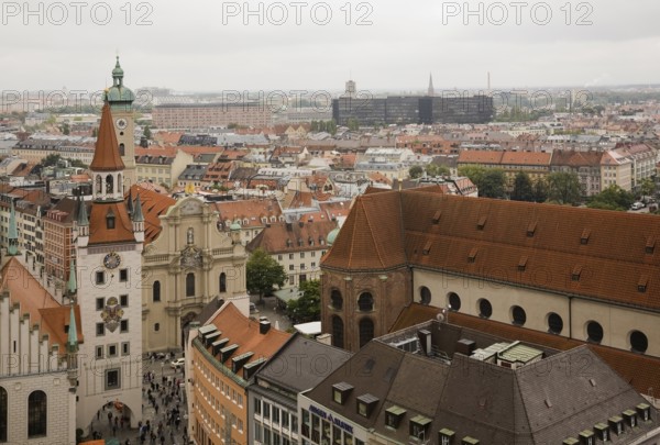 High angle view of buildings with traditional terracotta ceramic tiled rooftops surrounding the