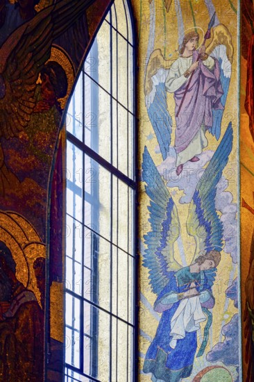 Window with frescoes and tiles in the Church of the Savior on Spilled Blood in the city of Saint