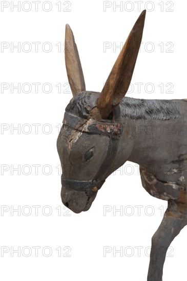 Head of the donkey, on a white background, detail of the palm donkey, wooden figure from around
