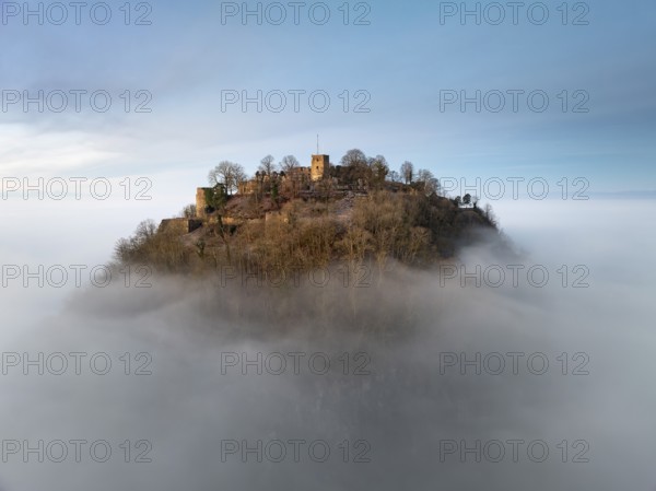Aerial view of the Hegau volcano Hohentwiel with the upper fortress ruins illuminated by the rising