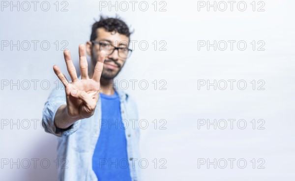 Portrait of people counting number four on isolated background. Person hand counting number four.