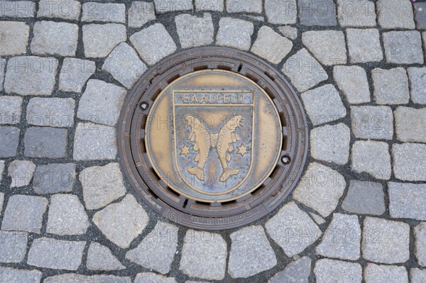 Municipal manhole cover with the coat of arms of Saalfeld, Kulmbach, Upper Franconia, Bavaria,