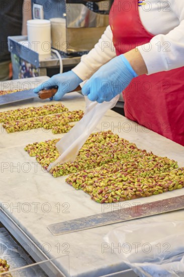 Person making traditional nougat, Ortygia, Syracuse, Sicily, Italy, Europe