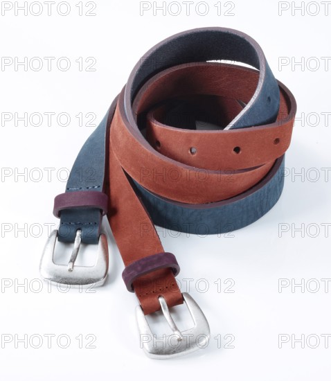 Leather belt in front of a white background, studio shot