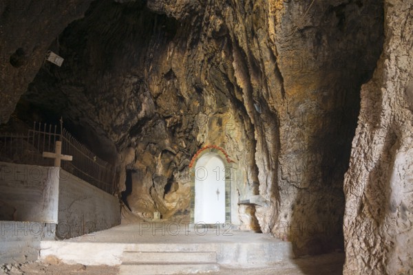 Entrance to cave with play of light, striking rock formation and steps, Church of Mary the Fountain