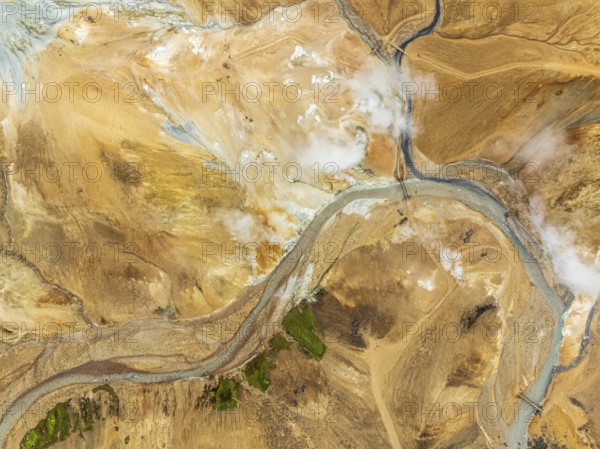 Steaming hot springs and colourful rhyolite mountains, aerial view, Hveradalir geothermal area,