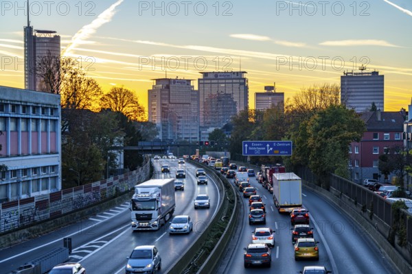 Evening traffic, partly with traffic jams, slow-moving traffic on the A40 motorway, skyline of