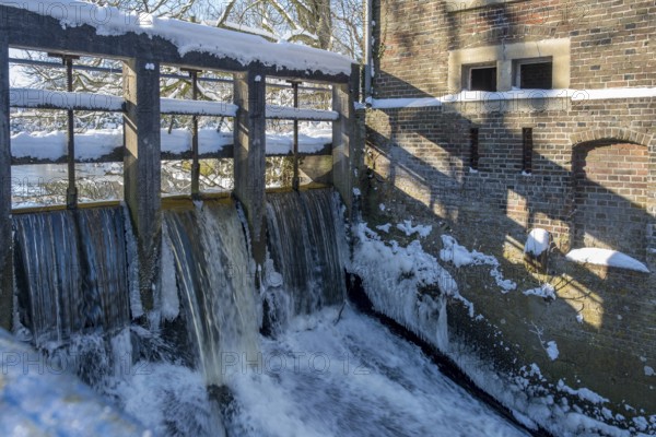 Weir at a watermill, Winter, Münsterland, North Rhine-Westphalia, Germany, Europe
