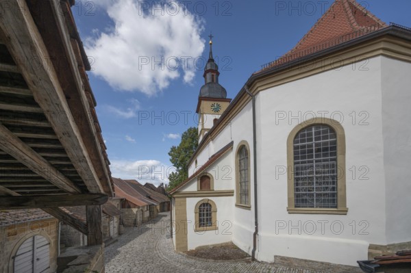 Former so-called Kirchgaden, barns, on the right the Protestant St John's Church in the historic