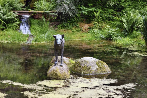 Heidelberg, Germany, June 8th 2024: Wolf sculpture at historic well called 'Wolfsbrunnen' in