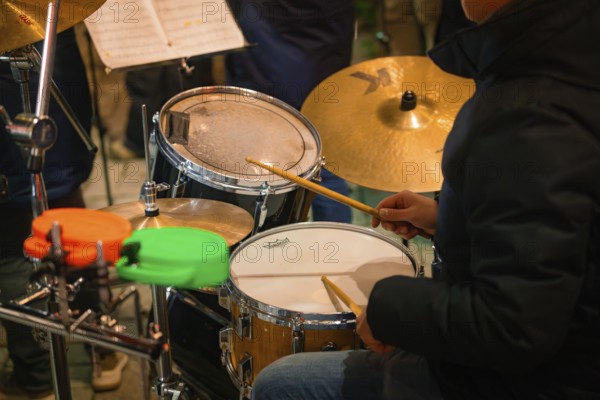 A musician plays drums, focus on the drums, Lichternacht Fest, Nagold, Black Forest, Germany,