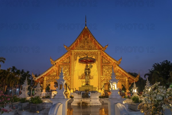 The Buddhist temple complex of Wat Phra Singh at dusk, Chiang Mai, Thailand, Asia