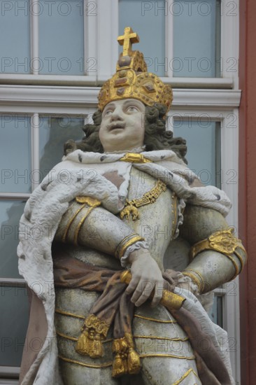 Sculpture of a Roman emperor with golden crown and cross, golden, view, detail, ancient king, Zum