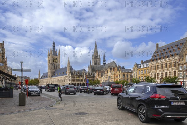 Cloth Hall with belfry and cars parked on the Grand Place at the city Ypres, Ieper, West Flanders,