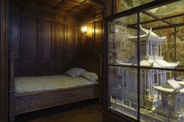 Bed and miniature ivory Chinese pagoda in the Louis XIV room at Kasteel van Gaasbeek, renovated