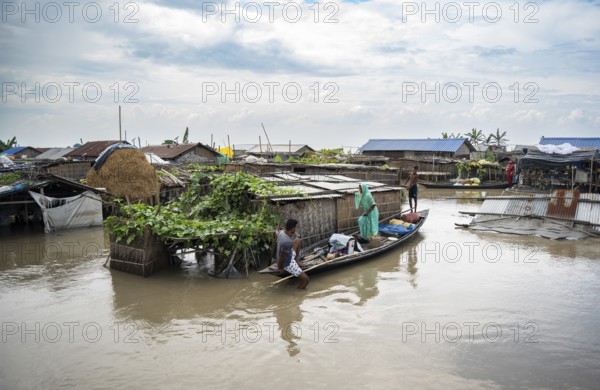 Morigaon, India. 4 July 2024. A settlement is partially submerged in flood in Morigaon district in