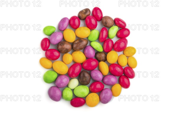 Pile of multicolored candies isolated on white background, chocolate dragees. close up, top view,