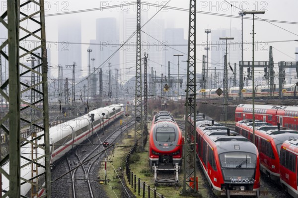 Railway tracks with regional and long-distance trains, ICE, after freezing rain, in front of