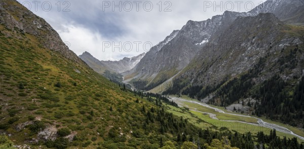 Green mountain valley with river and steep mountain peaks, Chong Kyzyl Suu Valley, Terskey Ala Too,
